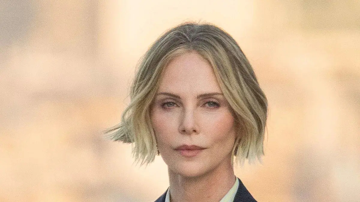 Charlize Theron showcases her famously toned legs in daring shorts at Paris photocall